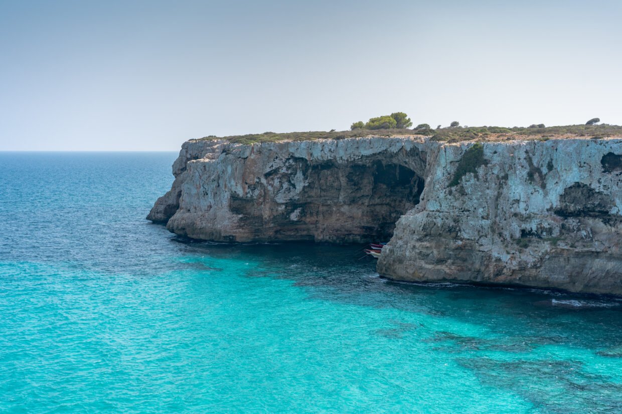 cliff in cristal clear water in mallorca, spain
